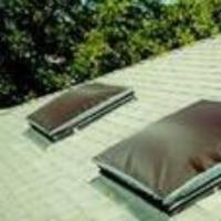 Square dome skylights with brown exterior solar shades.