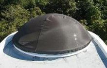 Round dome with dark brown skylight shade.